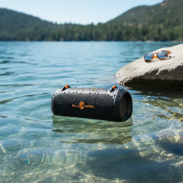 A Skullcandy Barrel speaker submerged partially in clear water, highlighting its IPX7 waterproof rating.